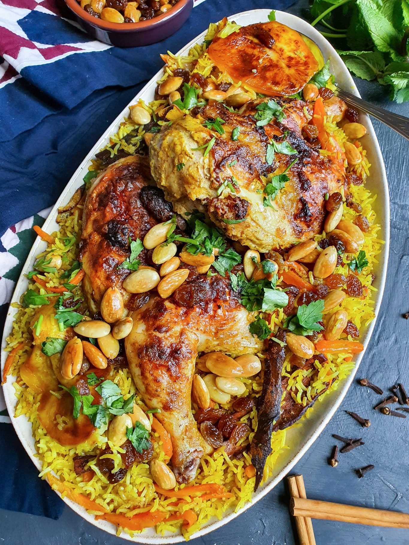 persian carrot rice with saffron chicken dish garnished with toasted almonds, sultanas, and finely chopped parsley. Looks so yummy!