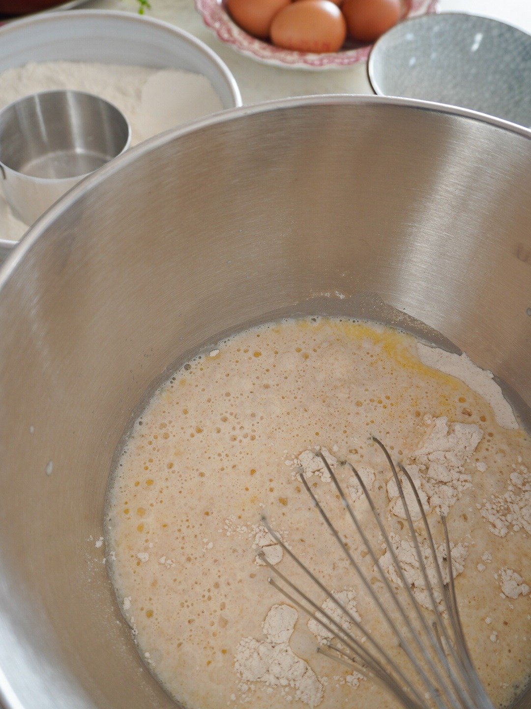 In a large bowl, combine 2 cup of flour, melted butter, milk, yeast, sugar and salt. Mix until blended.