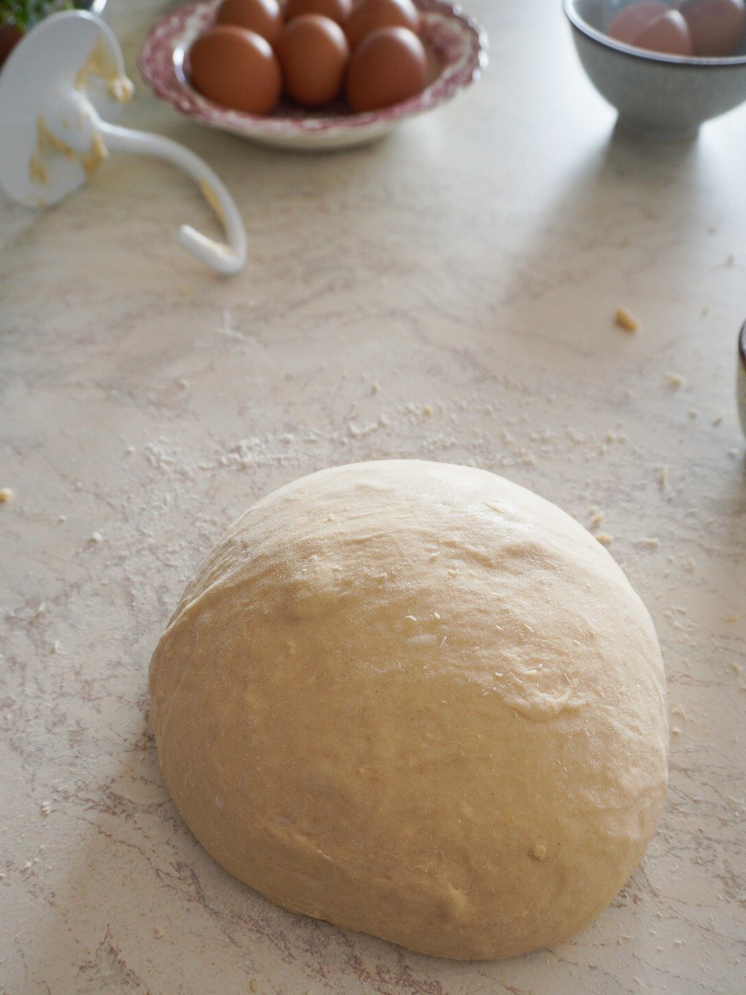 Knead your dough using a stand mixture until it comes together. Add the last 1 1/2 cup of flour 5 minutes into kneading.  Have your machine on low to begin with, slowly increasing the speed for about 10 - 15 minutes.  Your dough will also need 10 minutes of kneading by hand.  