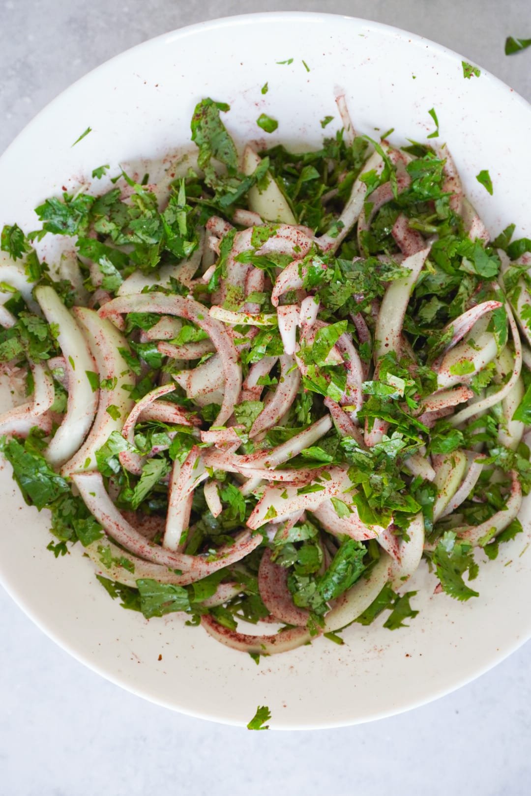 To prepare your salad is very simple.  Wash and chop a whole bunch of coriander.  Chop up 2 onions longways and sprinkle with the juice of 1 lemon and bit of sumac.