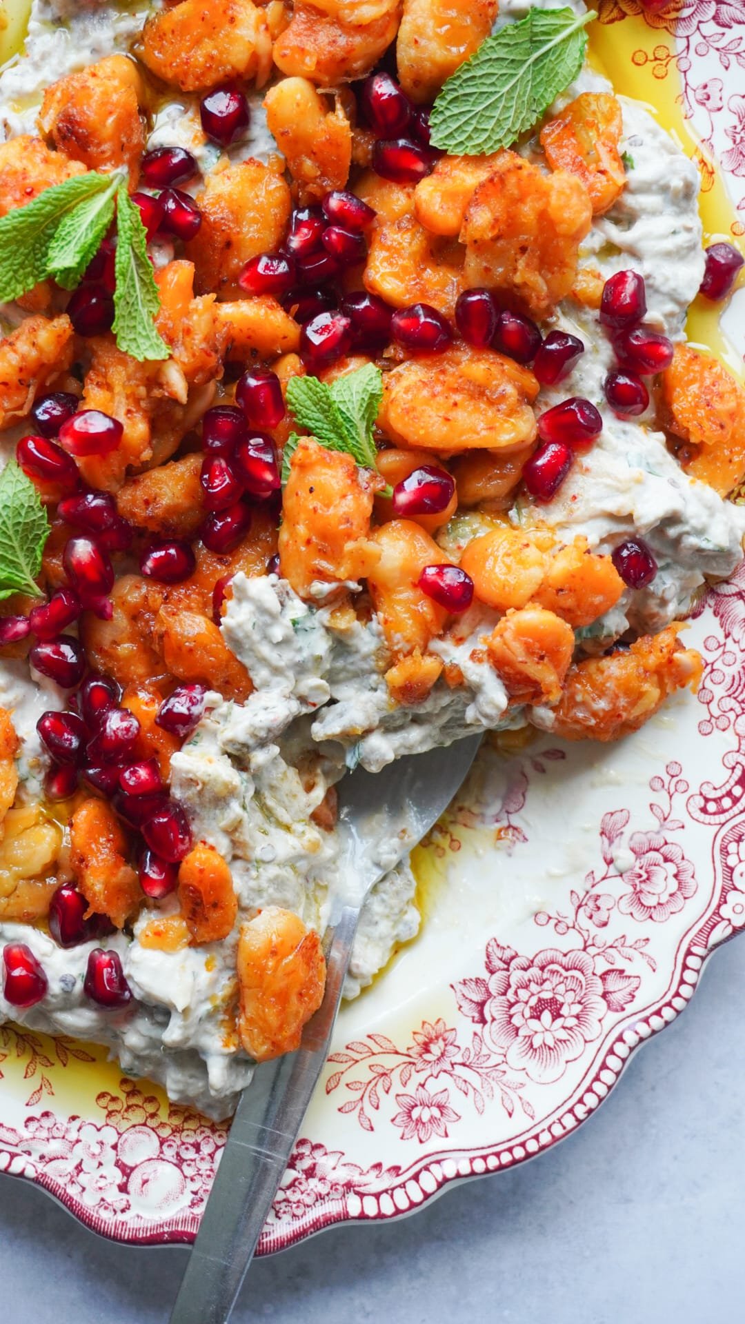 This Tahini Walnut Aubergine Dip with Crispy Butter Beans is absolutely delicious and perfectly presented with some pomegranate seeds topping.