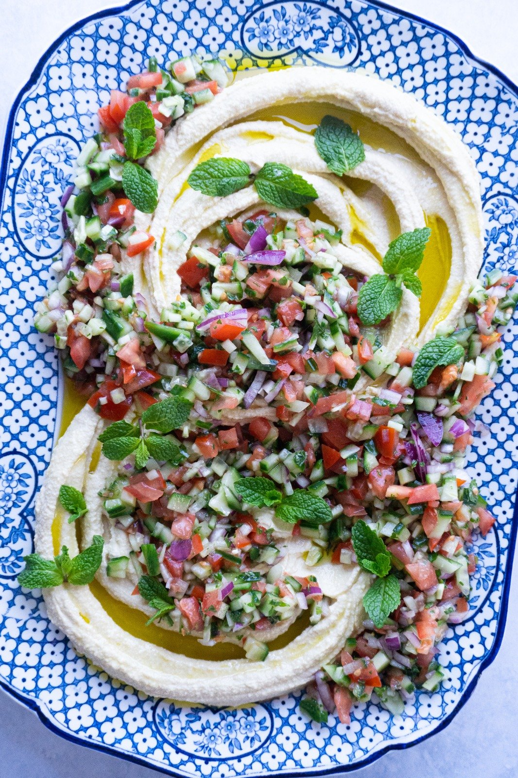 This Hummus Loaded With Shirazi Salad is just picture perfect, the mixture of vegetables, juices and herbs are absolutely delicious.