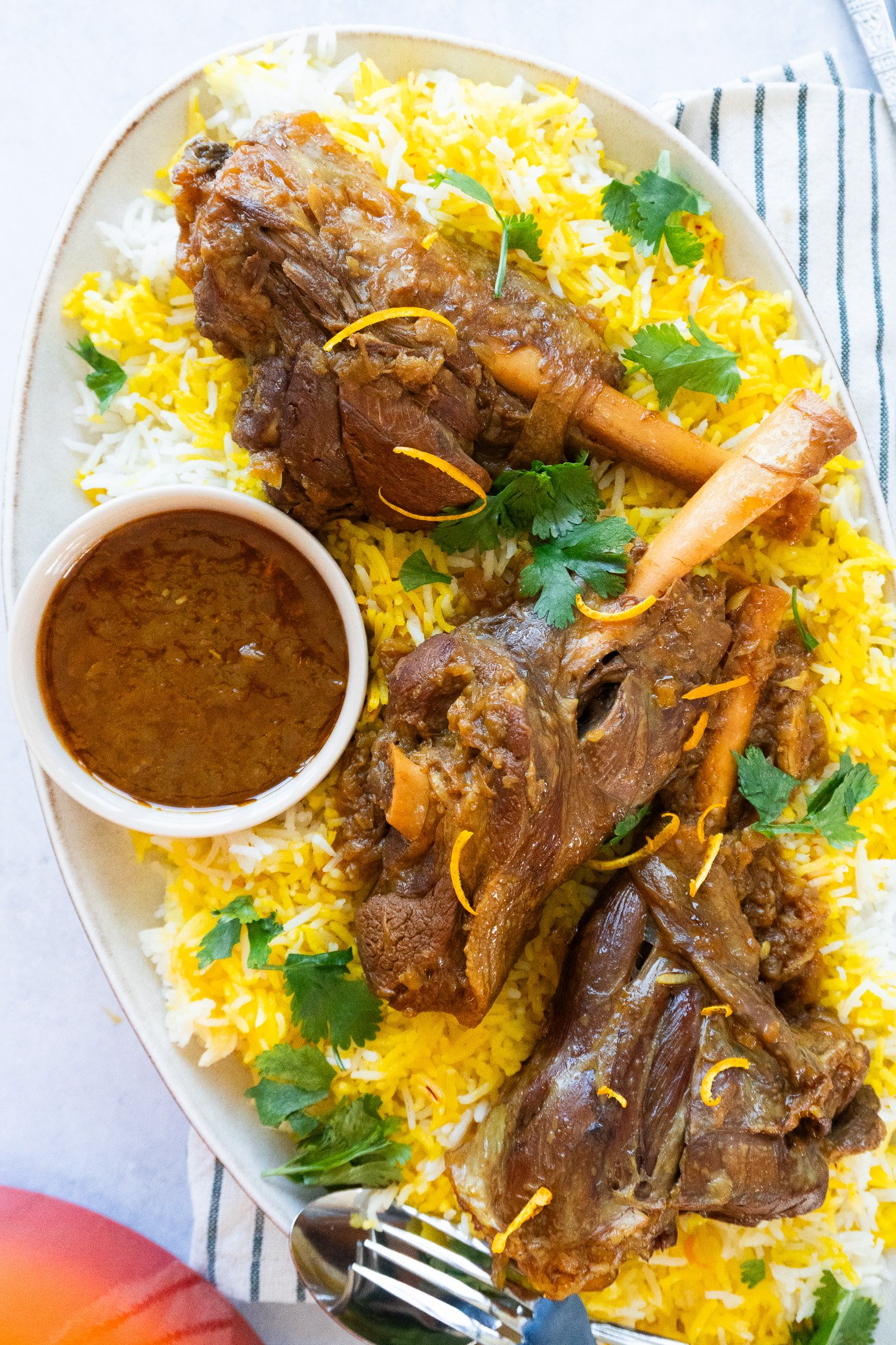 Delicious Persian Lamb Shank Recipe - Aromatic and tender lamb shank served with flavorful cooking juices.