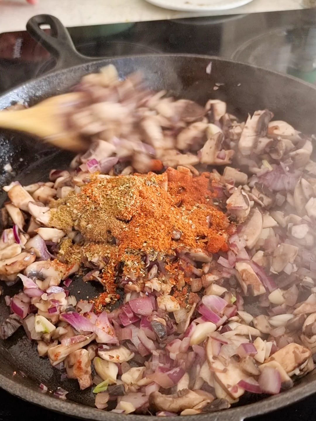Add the smoked paprika, cajun seasoning, oregano, ground cumin, ground turmeric and salt to the pan.