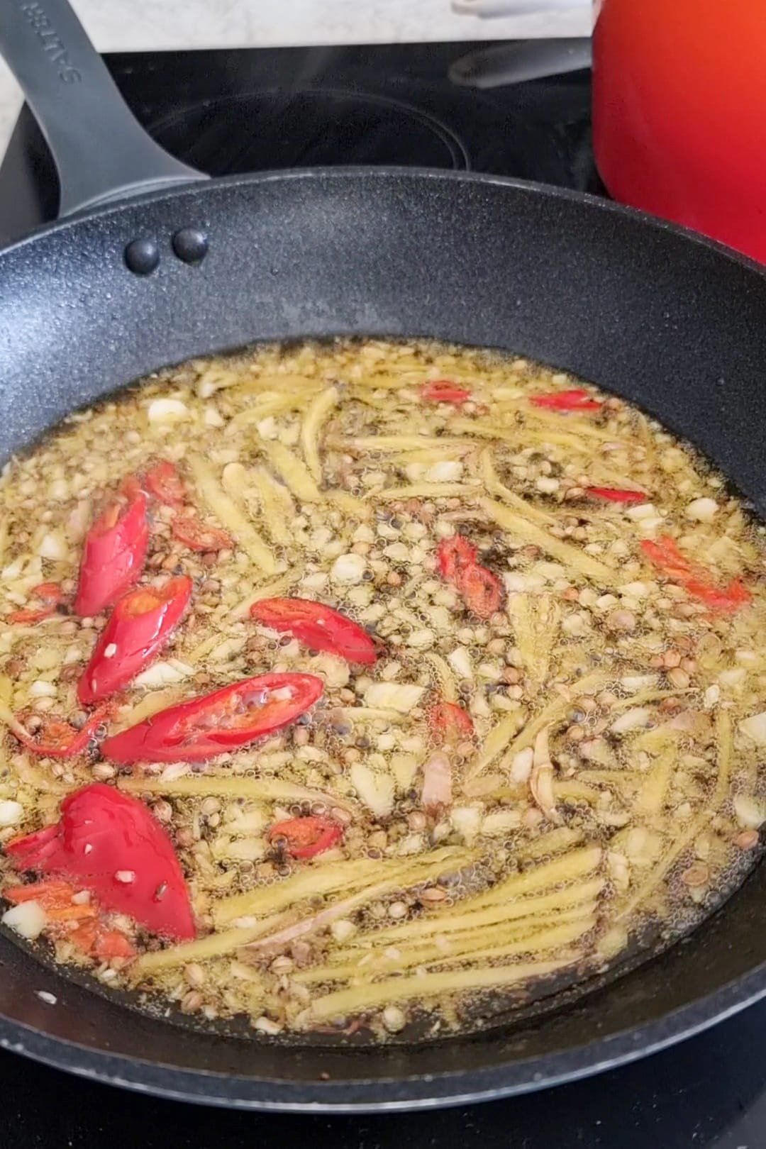  tadka spices ghee fried in a specific pan