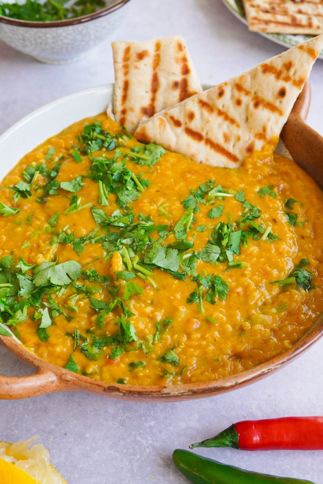 A fantastic mixture of vegetables and red lentils with spices served with chopped fresh coriander