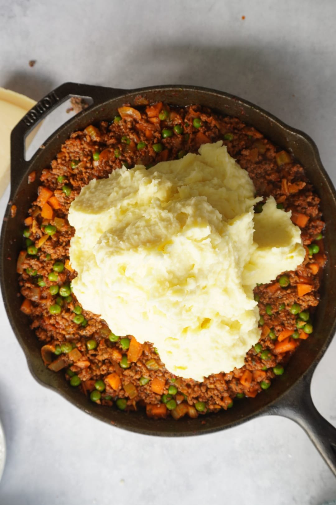 Layer the mash on top of the mixture for a Classic English Shepherds Pie