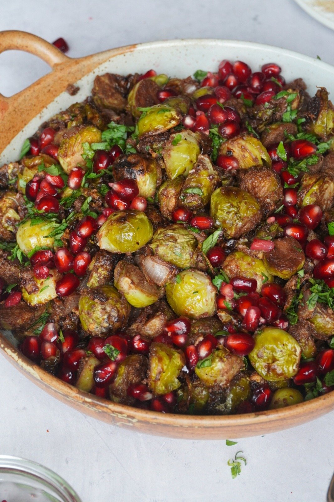 Roasted Brussel Sprouts garnished with pomegranate seeds 