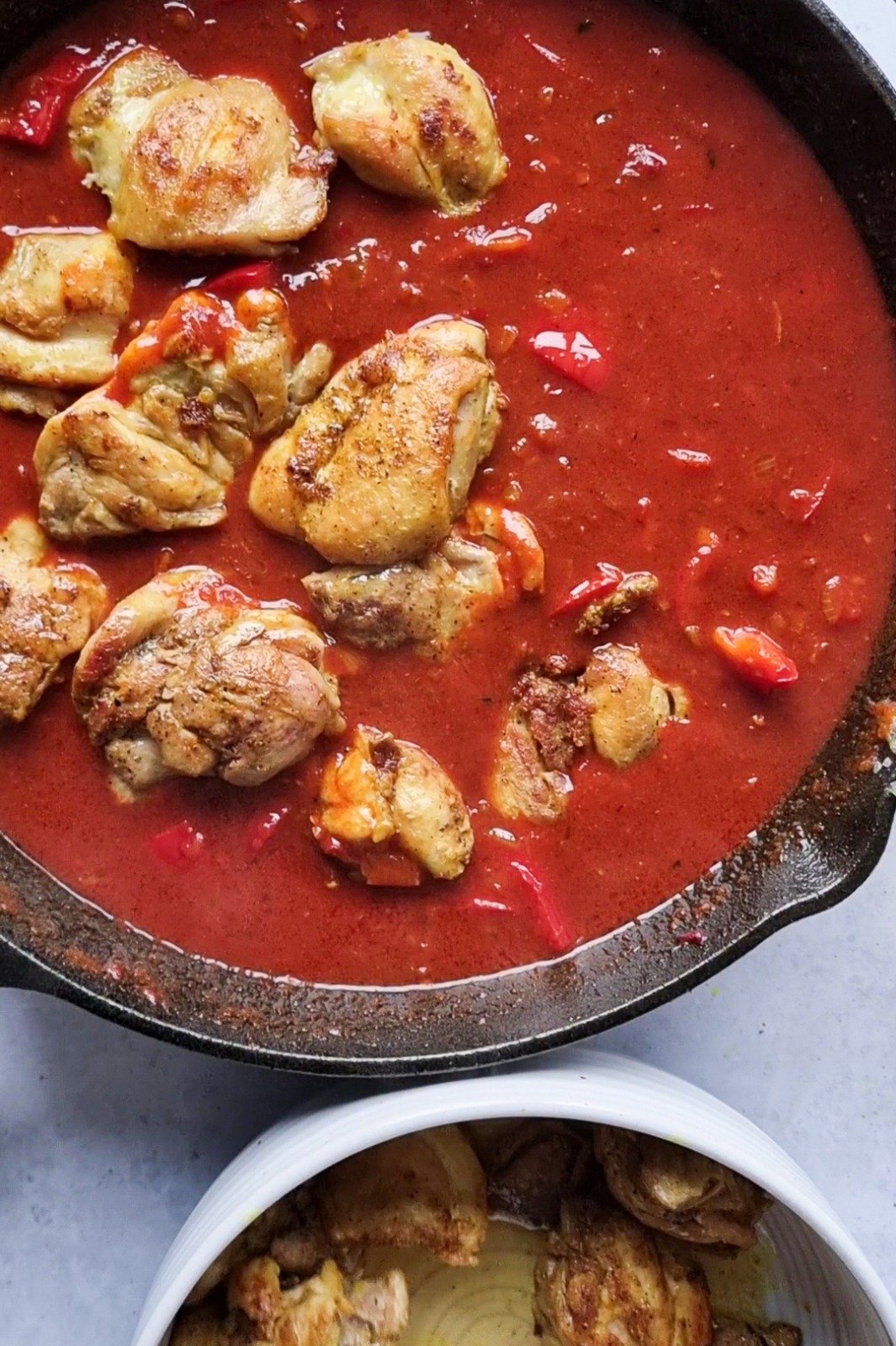 Gently place the chicken pieces back into the sauce to cook well.
