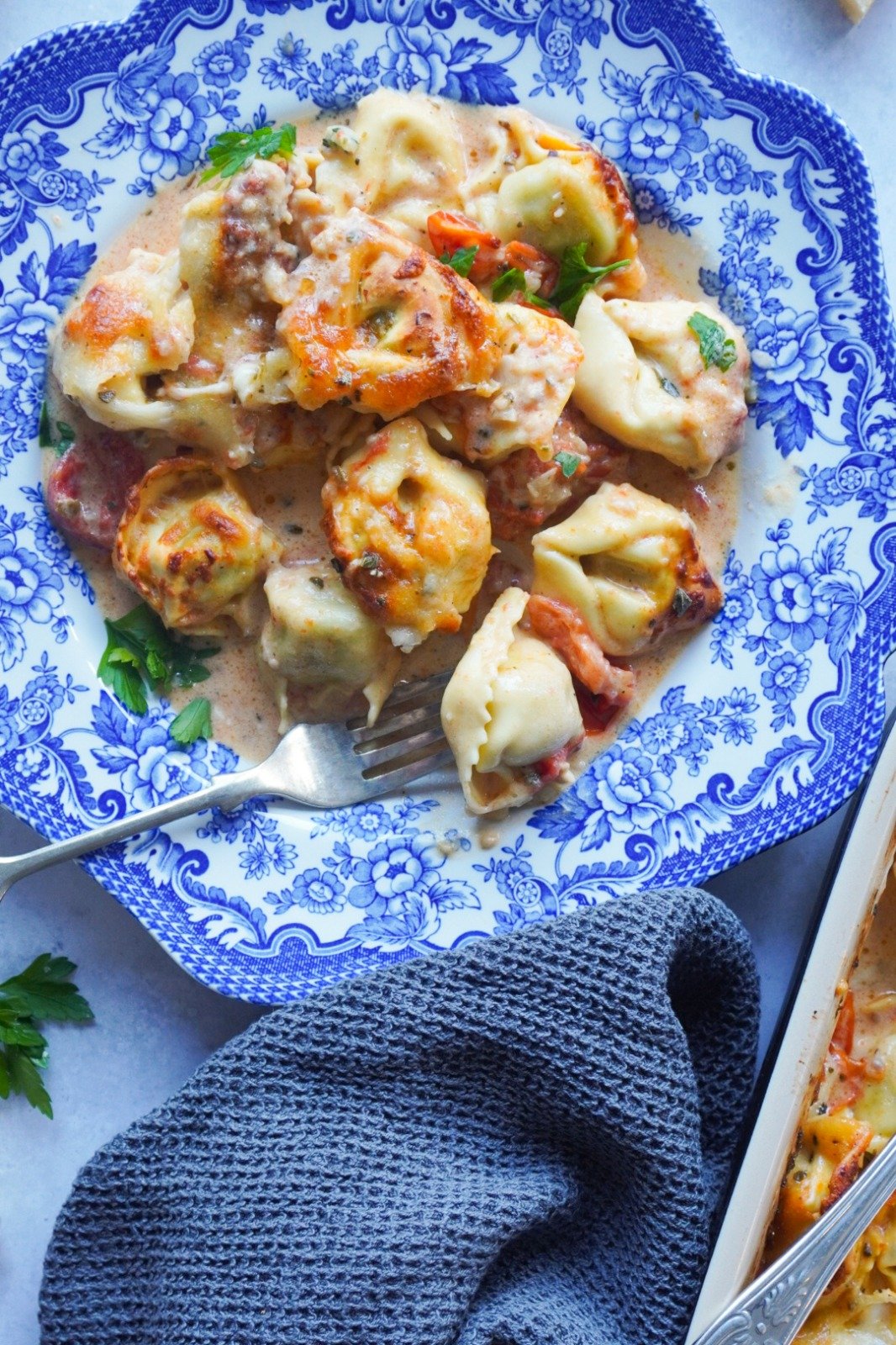 Delicious tortellini pieces covered in tomato sauce and spices to give you a Creamy Tomato Garlic Tortellini Bake