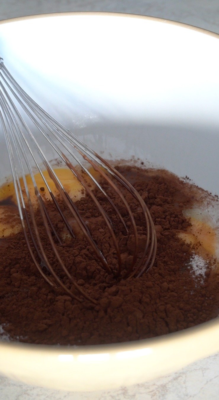 Hand whisk the ingredients in this Flourless Chocolate Cake to combine them well. 