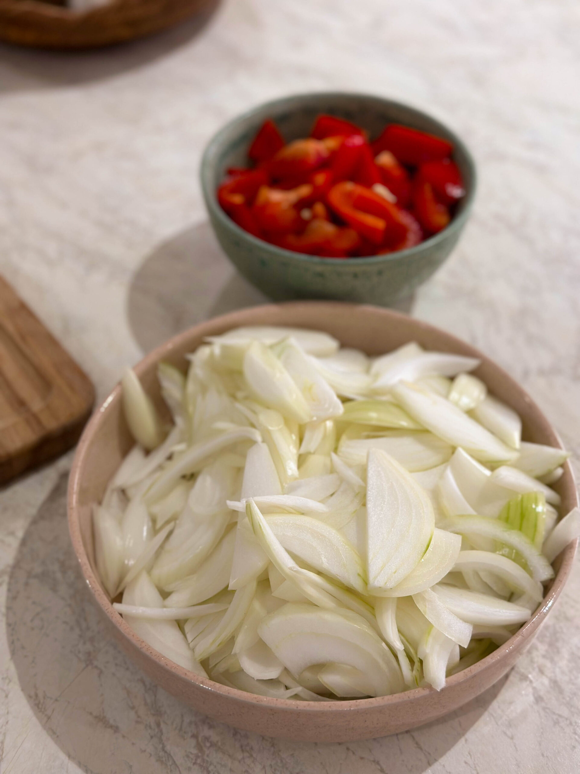 A collection of ingredients chopped and prepped ready for making the traditional Persian dish of Zereshk Polo Morgh- Persian barberry rice with chicken