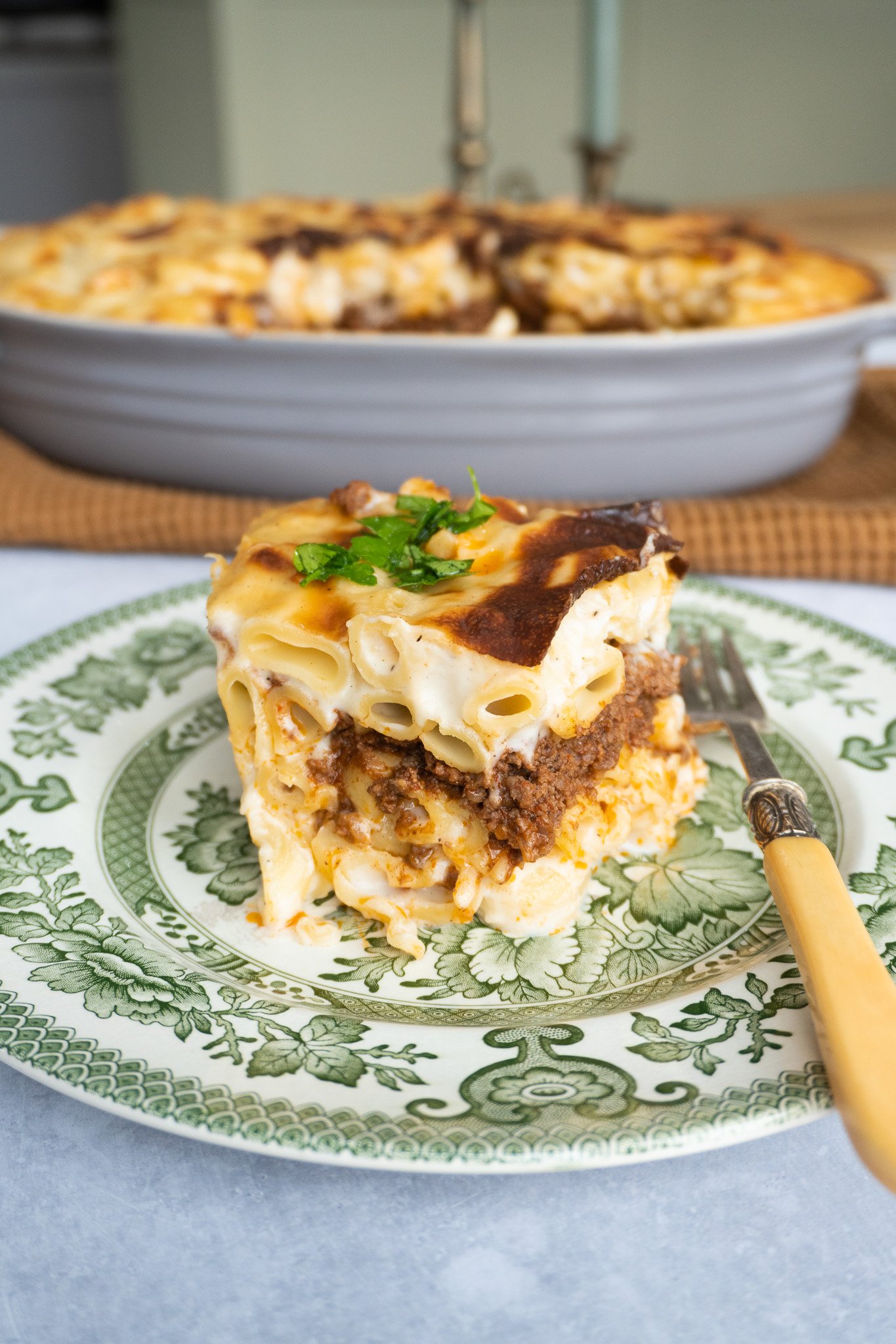 A close-up of Macarona Bechamel, showing the steamy interior. With pasta meat and sauce perfectly layered.