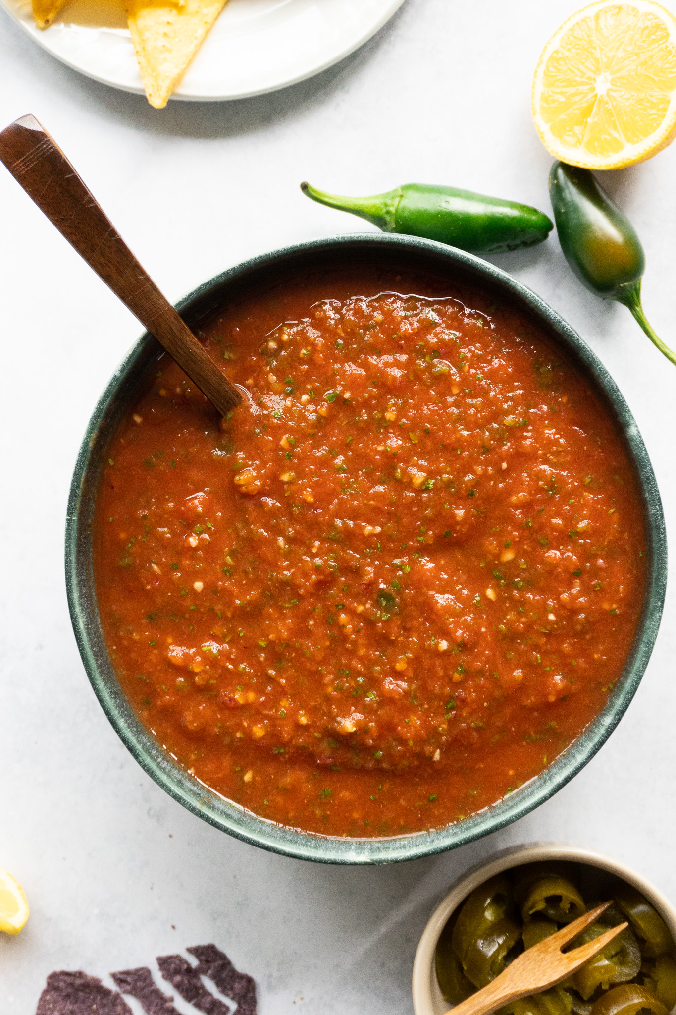 A tantalizing bowl of Classic Tomato Salsa (Costco Copycat), showcasing diced tomatoes, red onions, garlic, and cilantro, bursting with vibrant colors and fresh flavours.