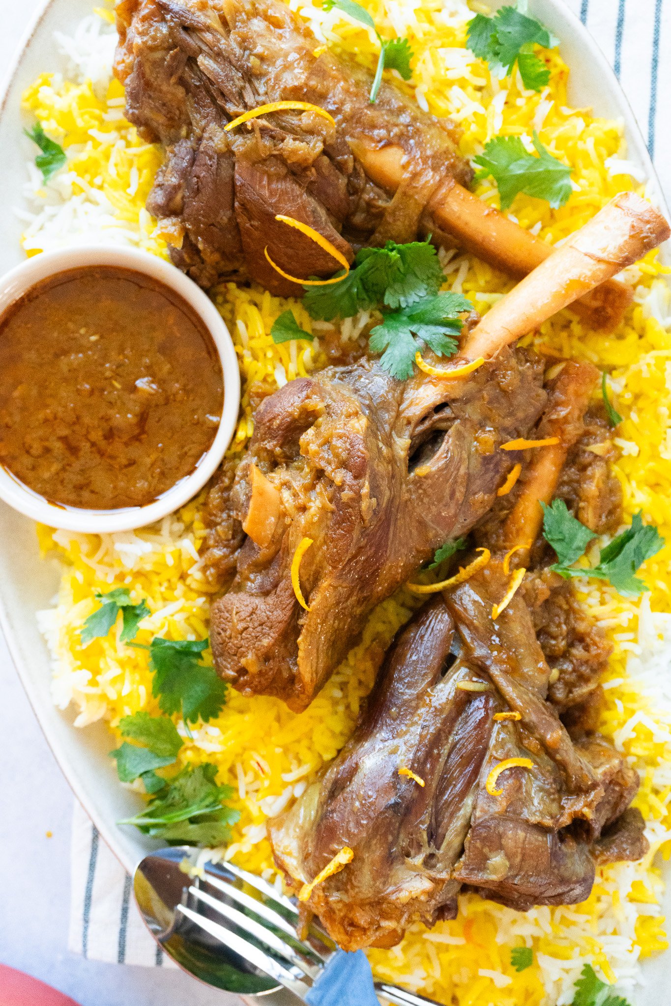 Delicious Persian Lamb Shank Recipe - Aromatic and tender lamb shank served with flavorful cooking juices.
