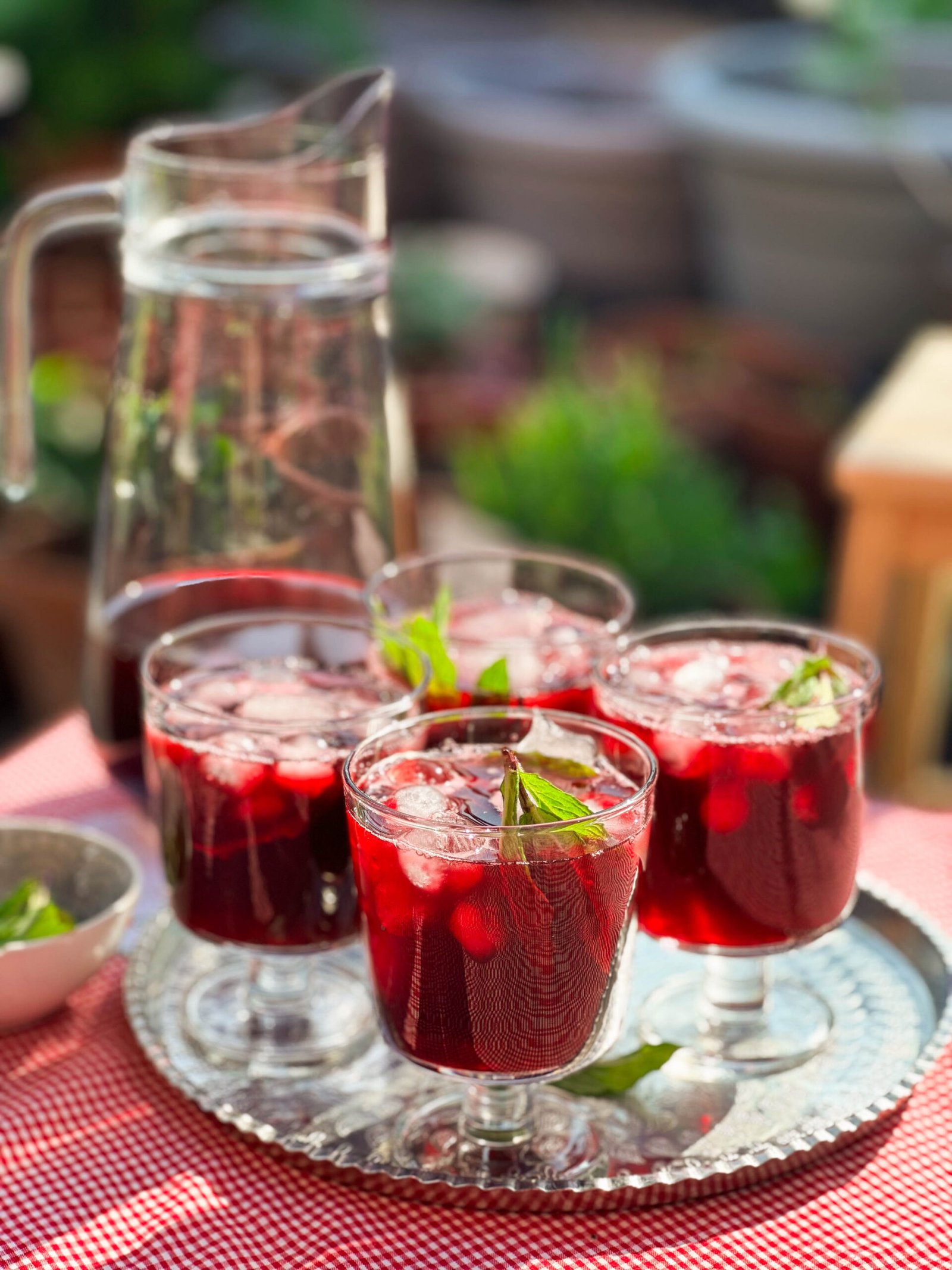 Close-up image of dried hibiscus flowers, showcasing their deep red color and crinkled texture, ready for making karkade (hibiscus tea)