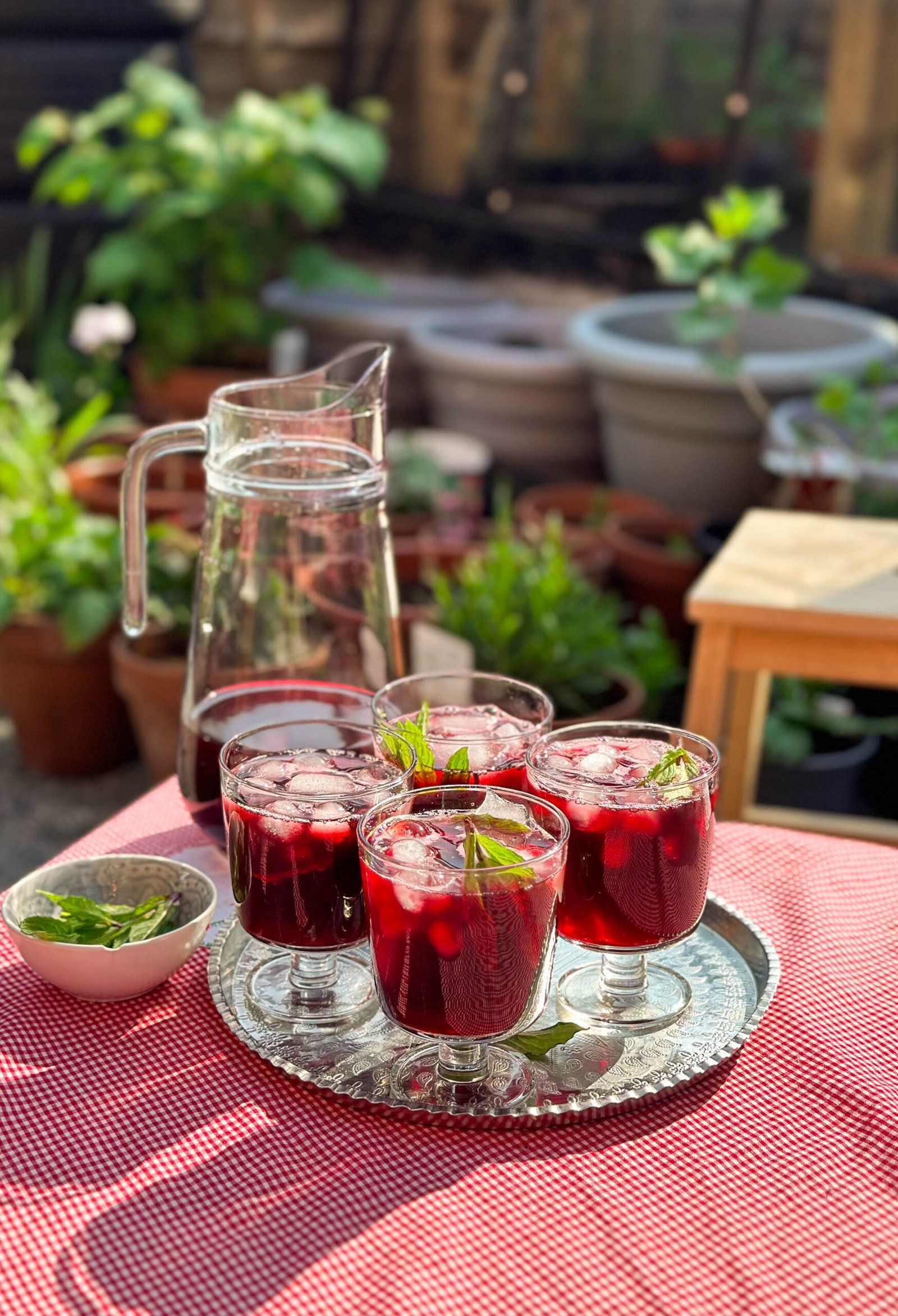 Close-up image of dried hibiscus flowers, showcasing their deep red color and crinkled texture, ready for making karkade (hibiscus tea)